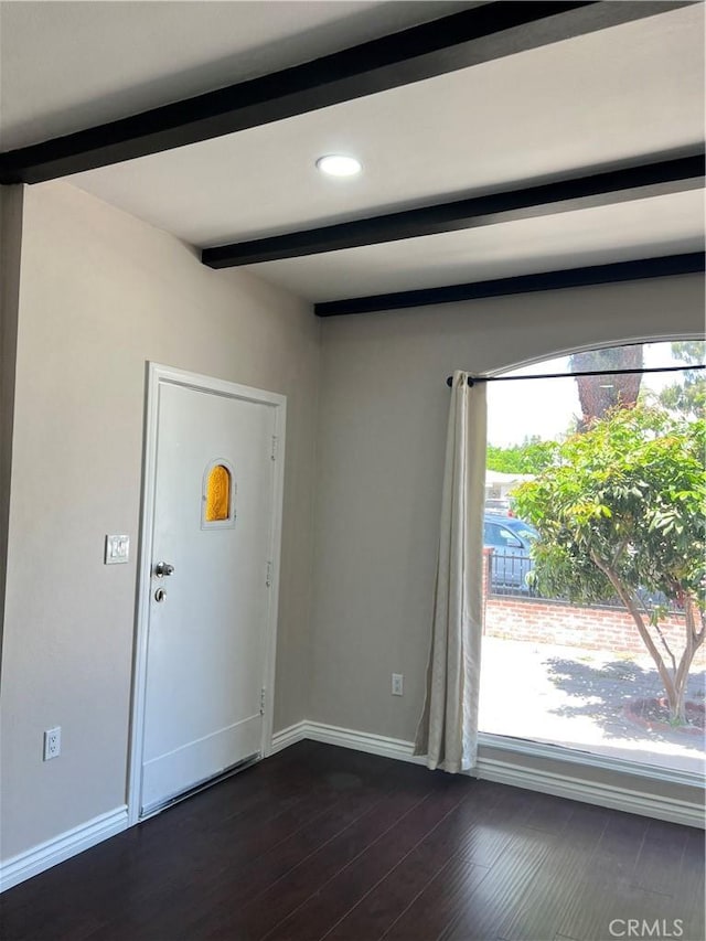 foyer entrance featuring dark wood-style flooring, recessed lighting, baseboards, and beam ceiling