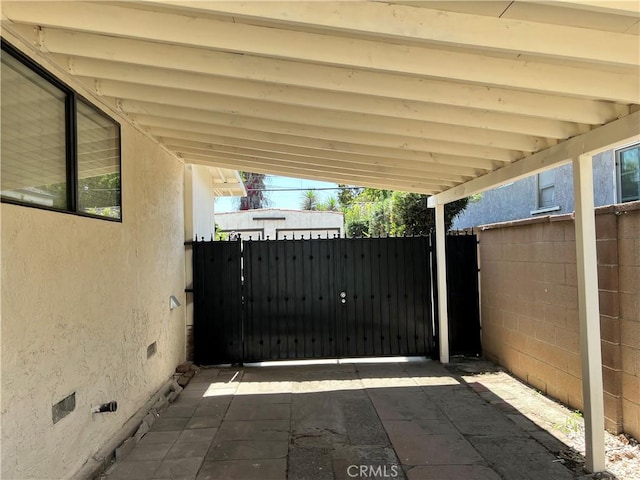 view of gate featuring fence