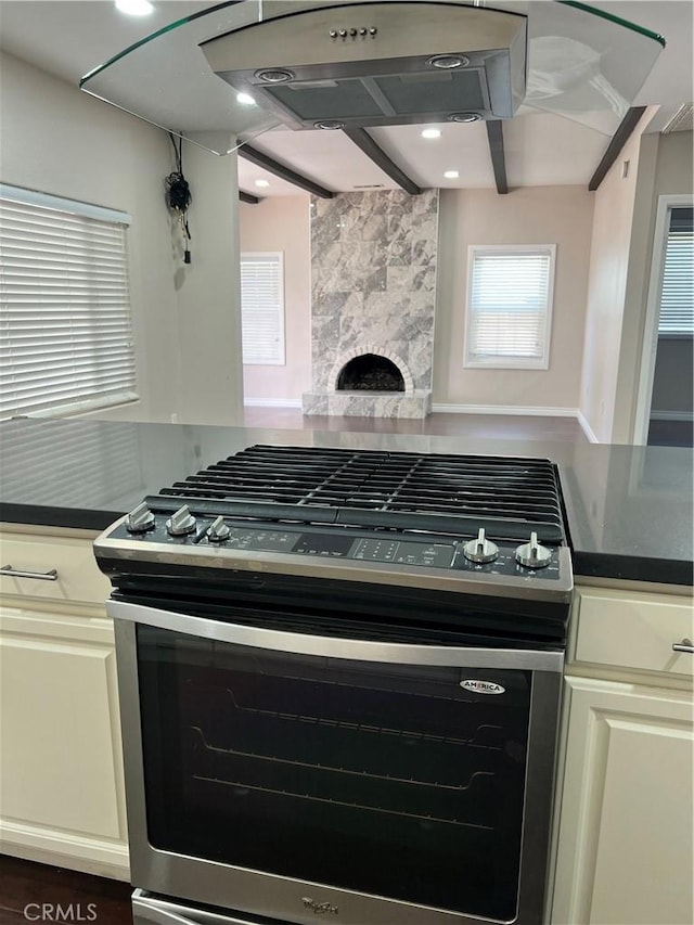 kitchen featuring dark countertops and stainless steel range with gas cooktop