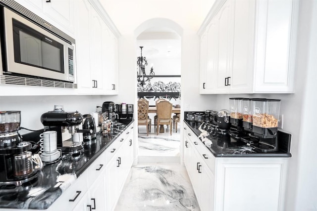 733 Clayburn Ct, Alpine, CA 91901 - bar with arched walkways, stainless steel microwave, and marble finish floor