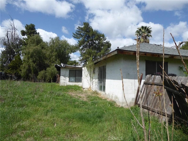 view of side of property featuring concrete block siding