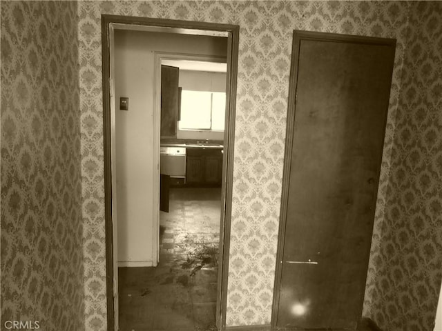 hall featuring a sink