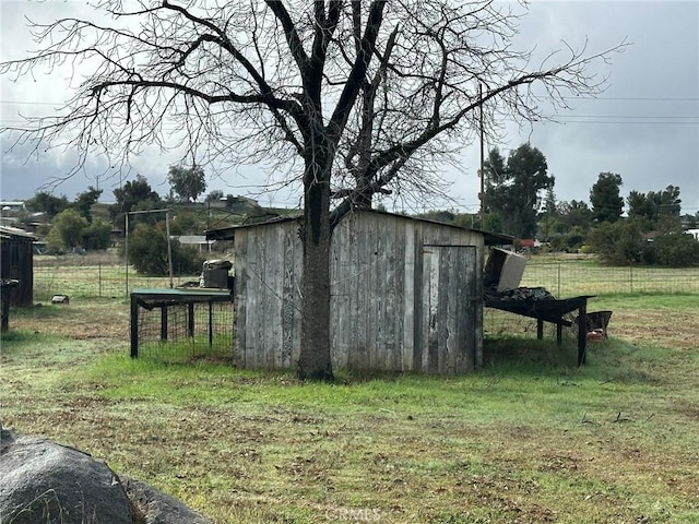view of shed with fence