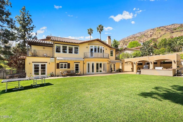 574 Camillo Rd, Sierra Madre, CA 91024 - back of property with french doors, a lawn, area for grilling, and a balcony