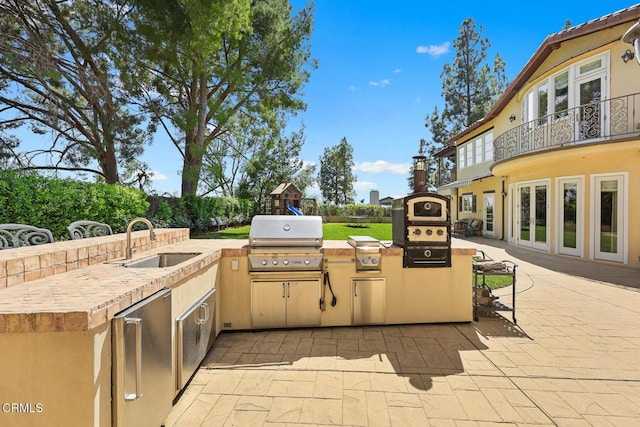574 Camillo Rd, Sierra Madre, CA 91024 - view of patio with an outdoor kitchen, a balcony, a playground, a sink, and a grill