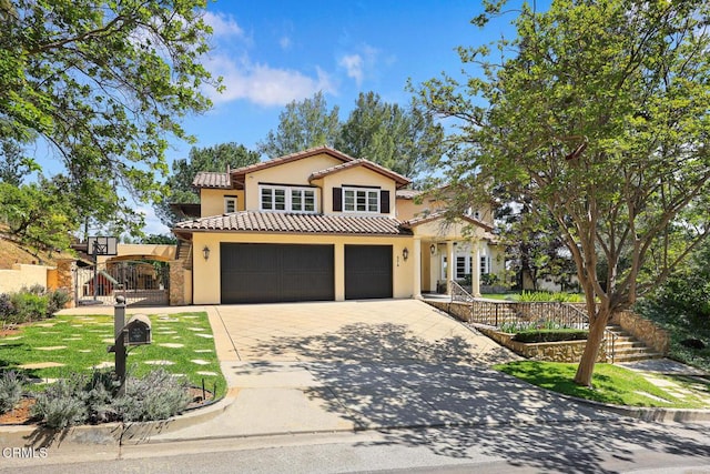 574 Camillo Rd, Sierra Madre, CA 91024 - mediterranean / spanish home with a garage, stucco siding, a gate, a tiled roof, and driveway