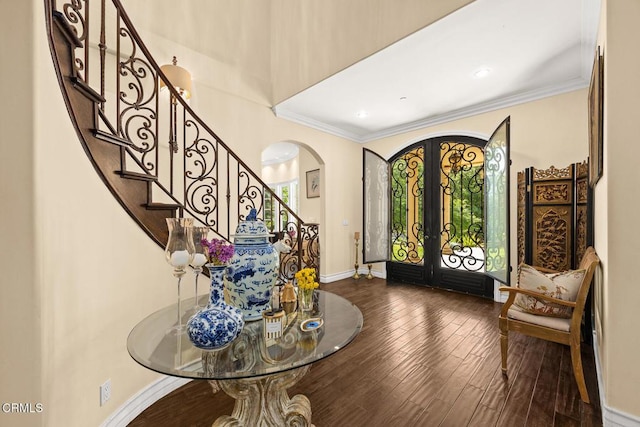 574 Camillo Rd, Sierra Madre, CA 91024 - foyer entrance with wood finished floors, baseboards, stairway, french doors, and arched walkways