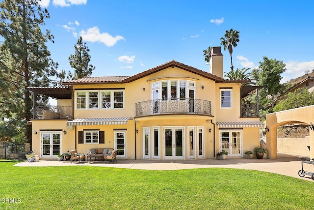 574 Camillo Rd, Sierra Madre, CA 91024 - back of property with a lawn, a balcony, french doors, and a chimney