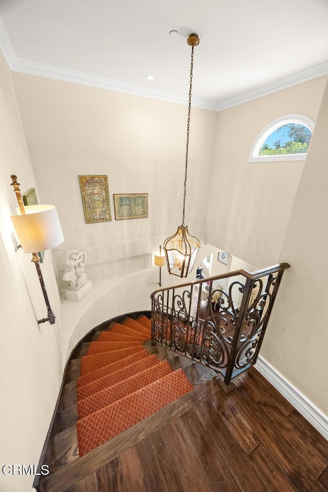 574 Camillo Rd, Sierra Madre, CA 91024 - staircase featuring crown molding, baseboards, a notable chandelier, and wood finished floors