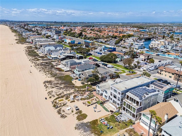 drone / aerial view with a residential view and a water view