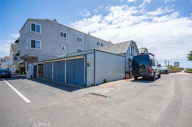 exterior space featuring uncovered parking