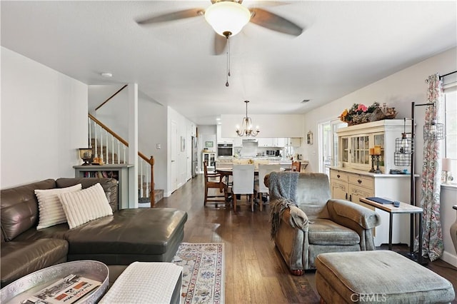 3571 White Wolf Ct, Merced, CA 95340 - living area with a chandelier, stairs, dark wood-type flooring, and a ceiling fan