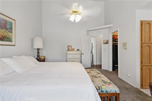 3571 White Wolf Ct, Merced, CA 95340 - bedroom featuring dark colored carpet, a walk in closet, and a closet