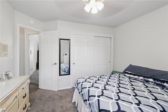 3571 White Wolf Ct, Merced, CA 95340 - bedroom featuring dark colored carpet, a closet, and a ceiling fan