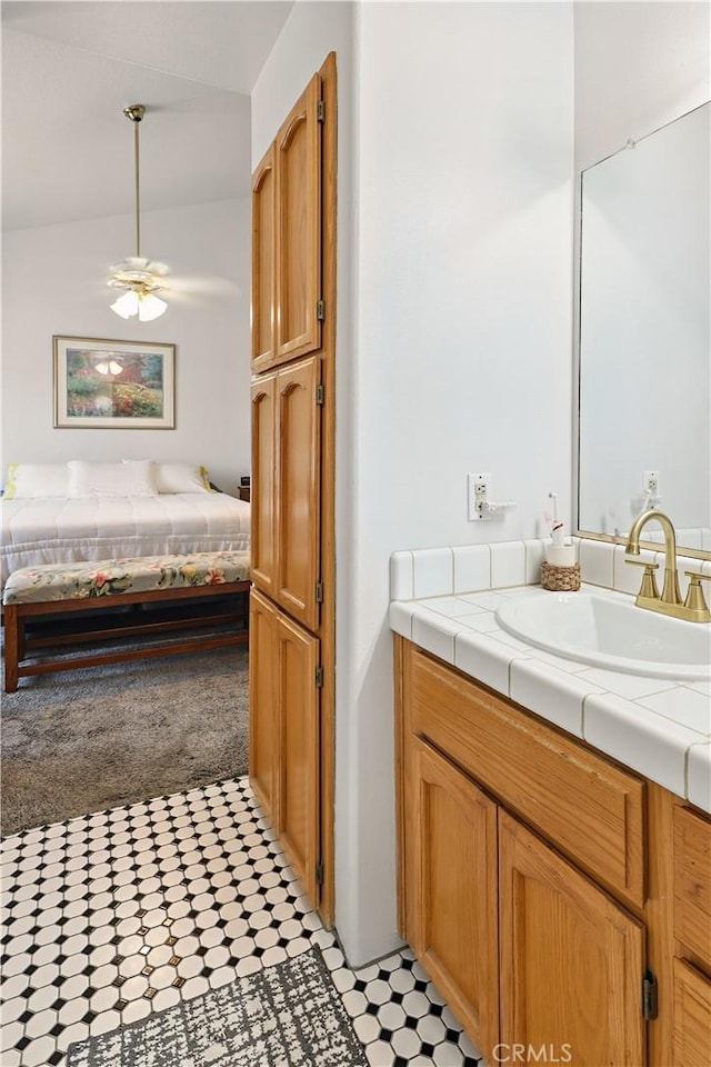 3571 White Wolf Ct, Merced, CA 95340 - ensuite bathroom featuring vanity, a ceiling fan, and vaulted ceiling