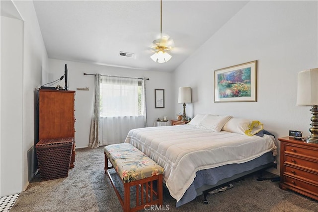 bedroom with carpet flooring, visible vents, and vaulted ceiling