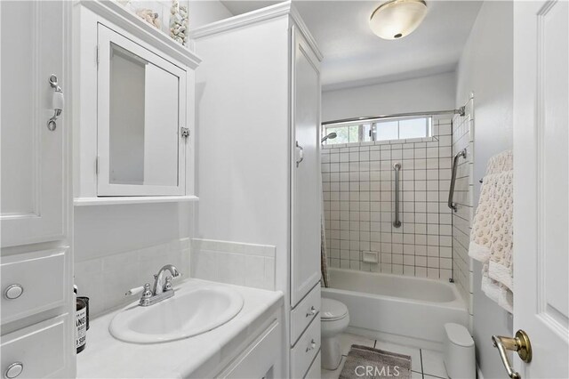 full bathroom featuring toilet, tile patterned flooring, bathing tub / shower combination, and vanity