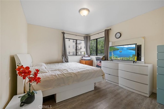 bedroom featuring wood finished floors