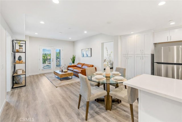 dining area featuring recessed lighting, baseboards, and light wood-style floors