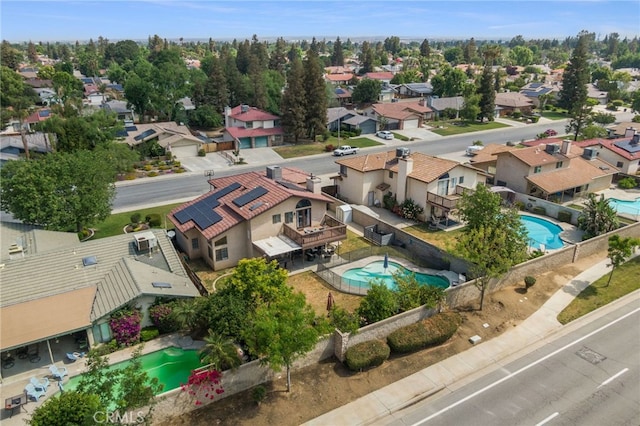 birds eye view of property with a residential view