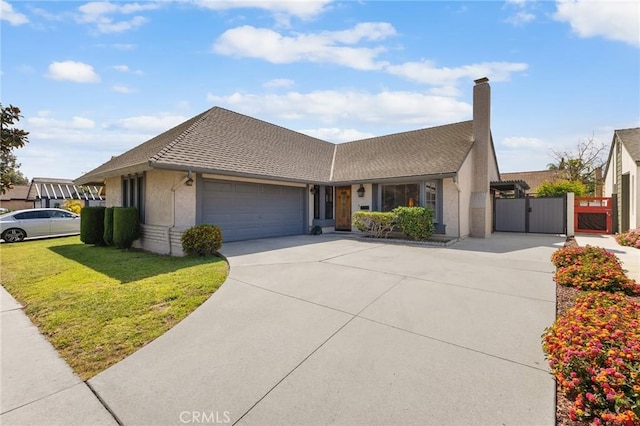 ranch-style home featuring a front yard, a gate, a shingled roof, concrete driveway, and an attached garage