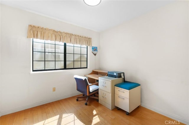 home office featuring light wood-style floors and baseboards