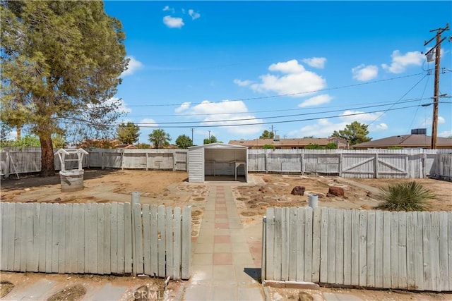 10341 N Loop Blvd, California City, CA 93505 - view of yard featuring an outbuilding and a fenced backyard