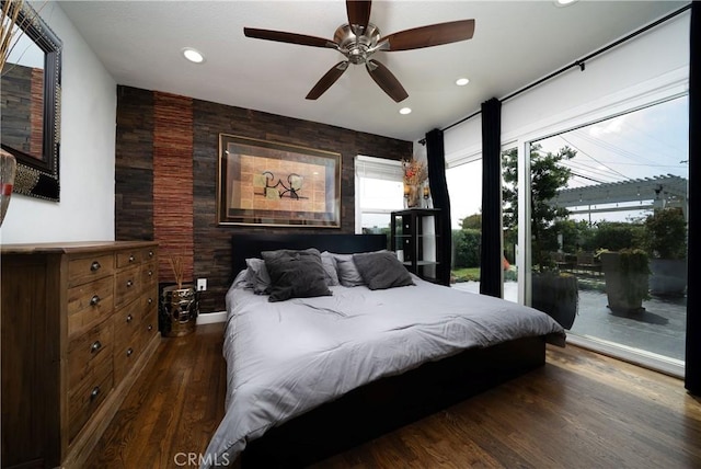 bedroom featuring ceiling fan, access to exterior, an accent wall, recessed lighting, and wood finished floors