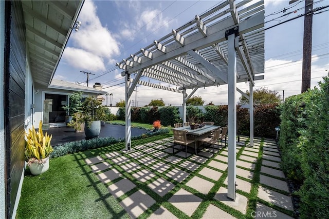 view of patio / terrace featuring fence, a pergola, and outdoor dining space