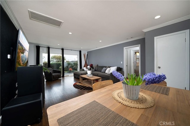 living room featuring visible vents, recessed lighting, wood finished floors, and ornamental molding