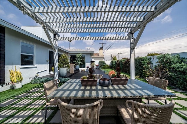 view of patio / terrace featuring a pergola, fence, and outdoor dining space