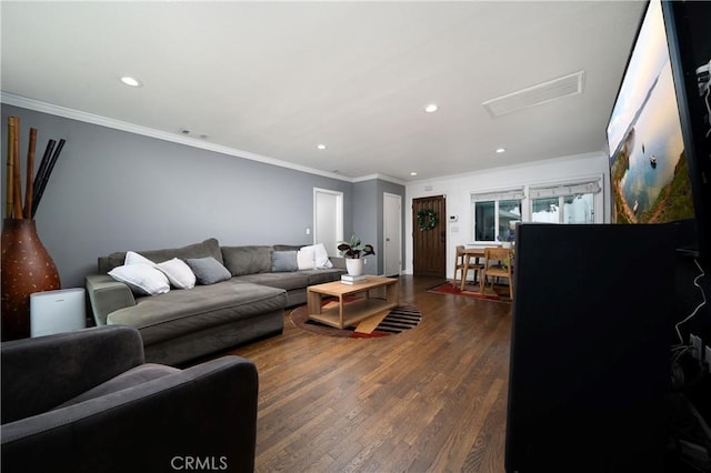living room with recessed lighting, visible vents, attic access, and dark wood-type flooring