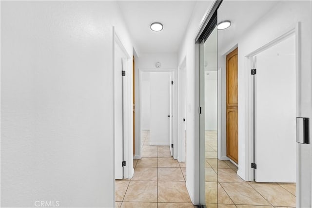 hallway with light tile patterned floors