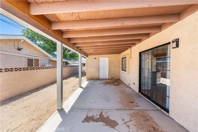 view of patio / terrace featuring fence