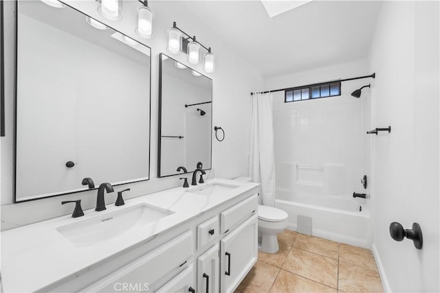 bathroom with double vanity, a sink, toilet, and shower / tub combo