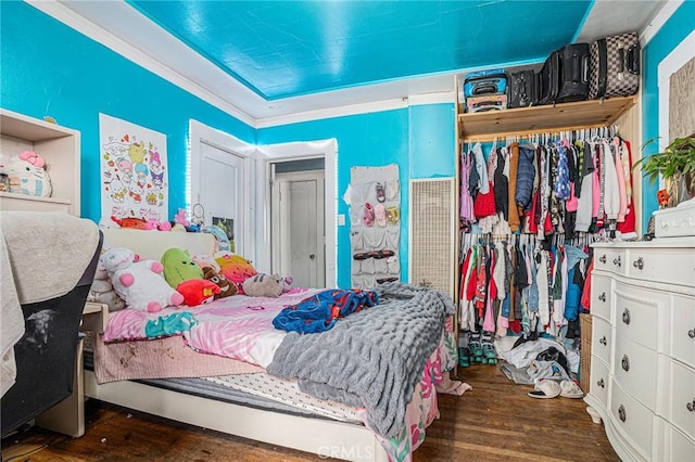 bedroom with wood finished floors