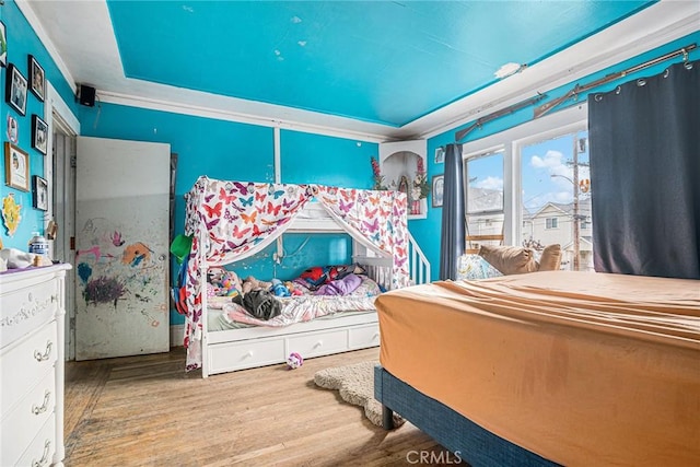 bedroom with wood finished floors