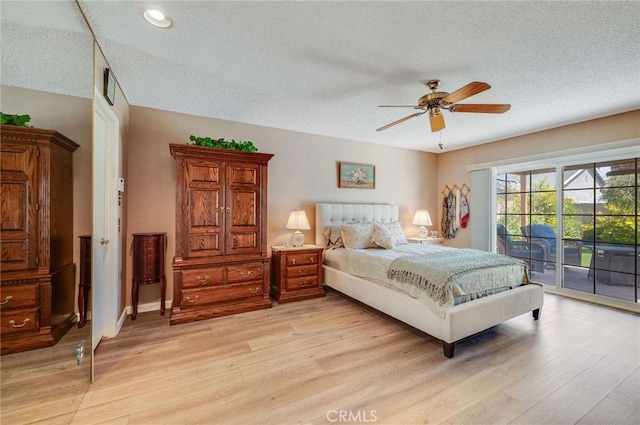 bedroom with a textured ceiling, access to outside, recessed lighting, and light wood-style flooring
