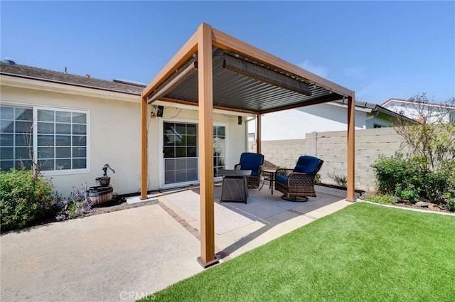 view of patio featuring fence