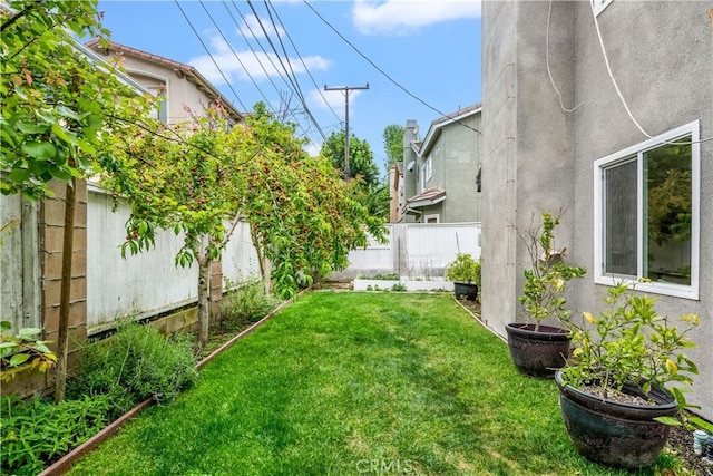 view of yard with a fenced backyard