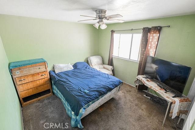 bedroom with carpet flooring and a ceiling fan
