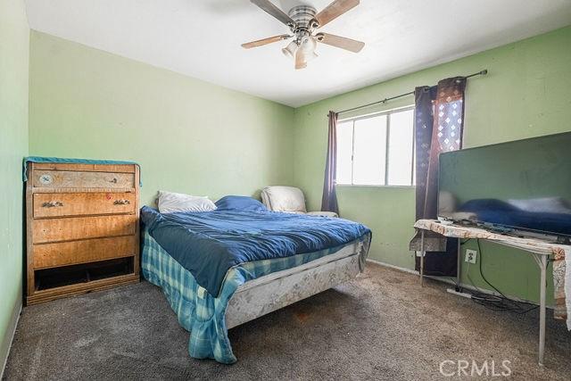 bedroom with carpet floors and a ceiling fan