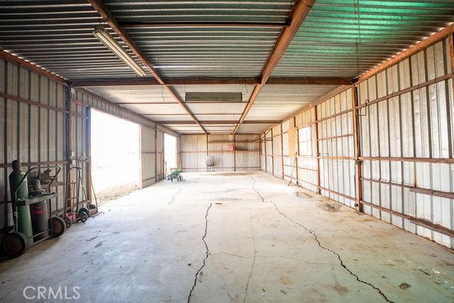 misc room with unfinished concrete floors