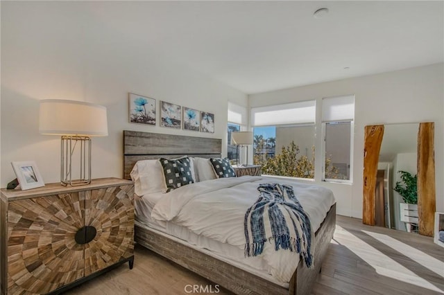 bedroom with wood finished floors