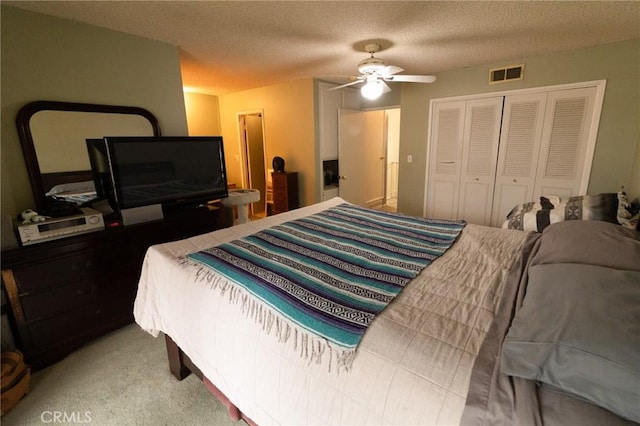 8060 Canby Ave Unit 2, Reseda, CA 91335 - bedroom with a closet, light carpet, a textured ceiling, and a ceiling fan