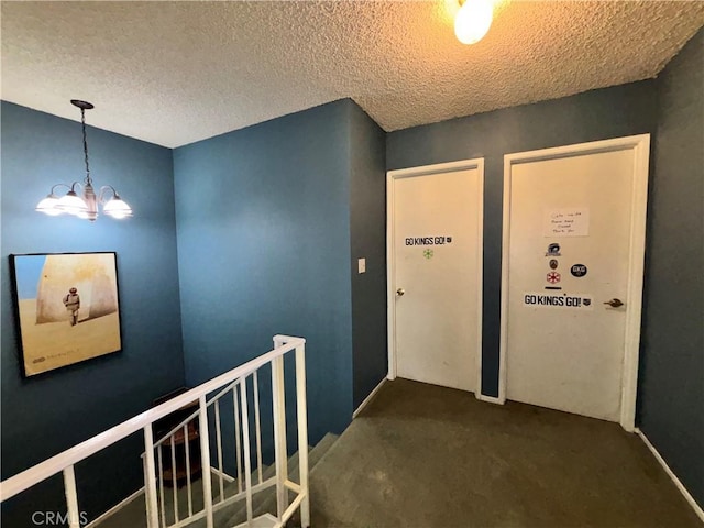 8060 Canby Ave Unit 2, Reseda, CA 91335 - corridor featuring a chandelier, carpet flooring, a textured ceiling, and an upstairs landing