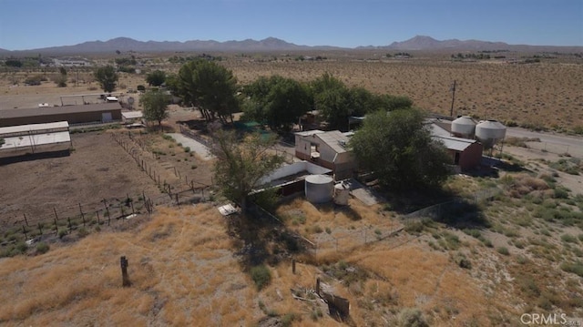 aerial view with a rural view, a mountain view, and view of desert
