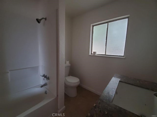 bathroom featuring baseboards,  shower combination, and toilet