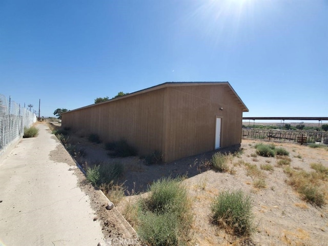 view of property exterior with fence