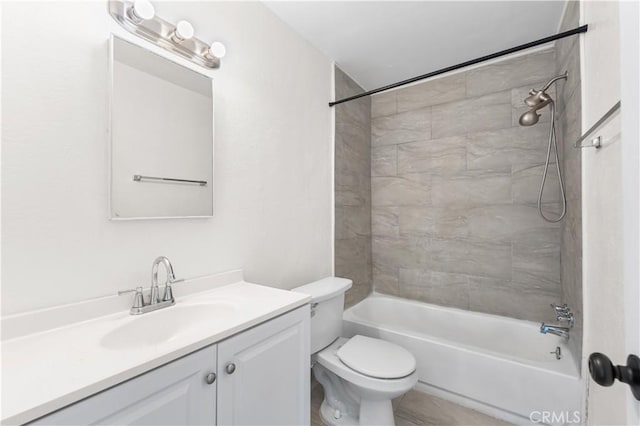 bathroom with vanity, toilet, and tub / shower combination